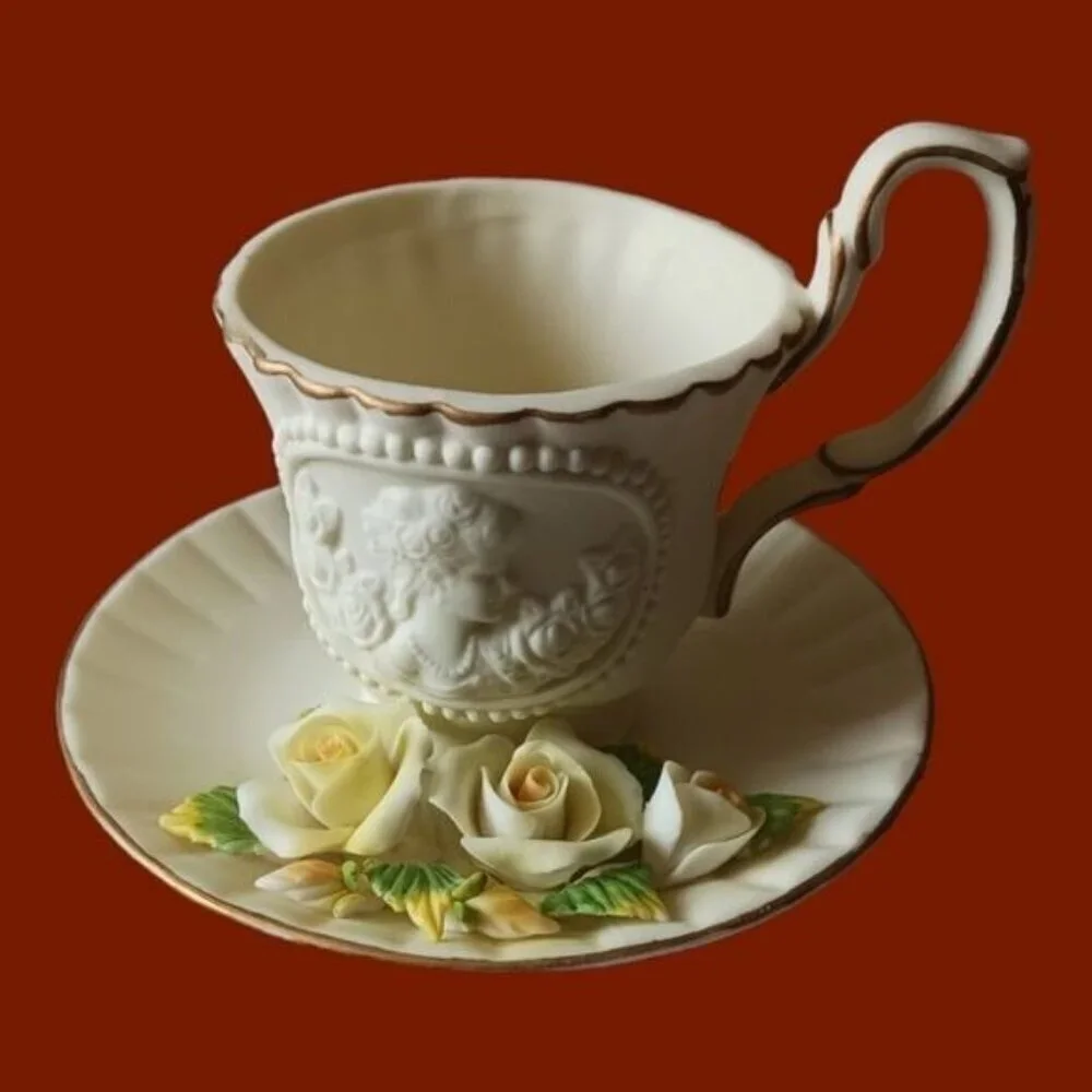 Teacup & attached saucer with yellow roses